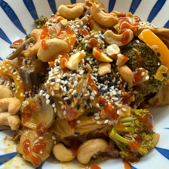 Coconut Curry Tofu Knots with sesame seeds and cashews