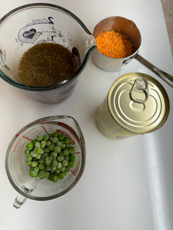 Broth, lentils, crushed tomatoes, and sweet peas