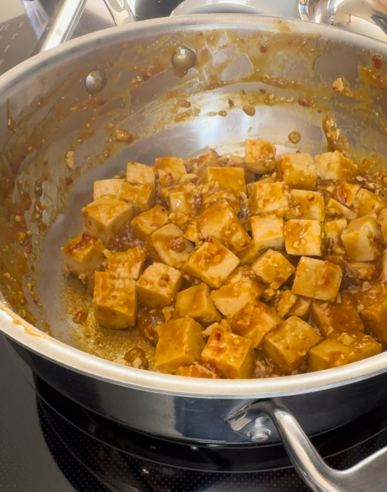 Sticky tofu being sautéd