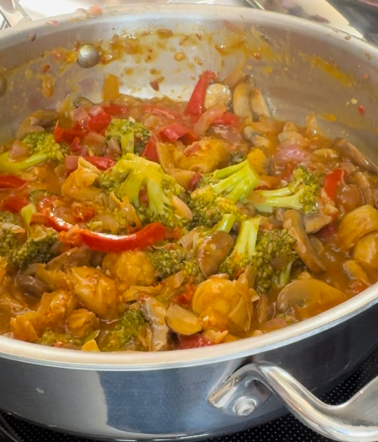 Veggies, tofu knots, and sauce added