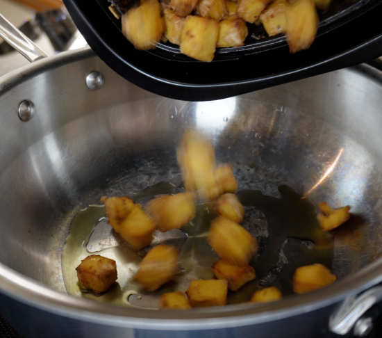 Adding tofu to pan