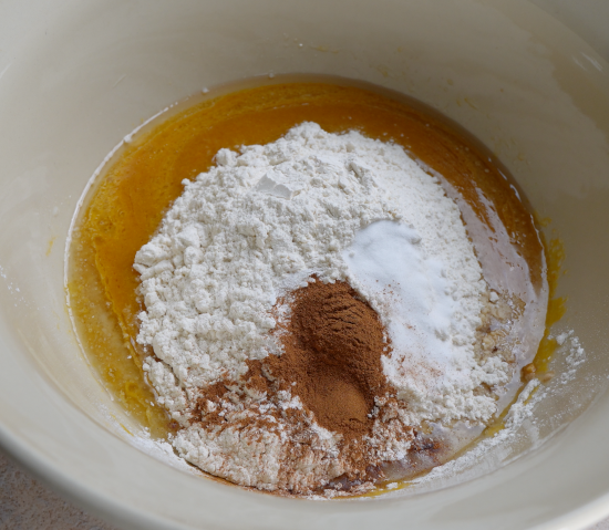 Cinnamon and nutmeg added to mixing bowl