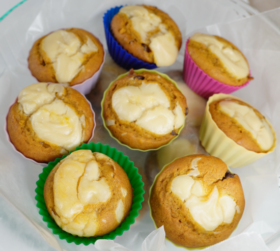 Pumpkin chocolate chip cream cheese cupcakes in storage container