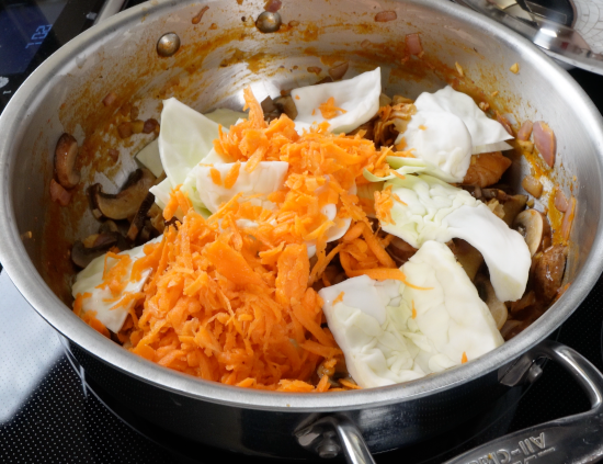 Shredded carrots and cabbage leaves added