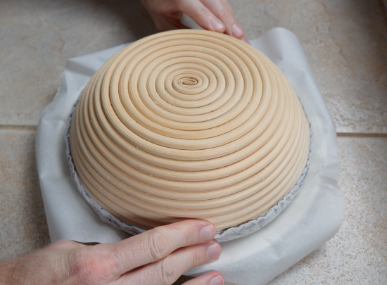 Removing the dough from the proofing basket