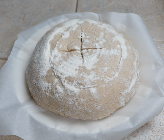 Scored sourdough ready to be baked