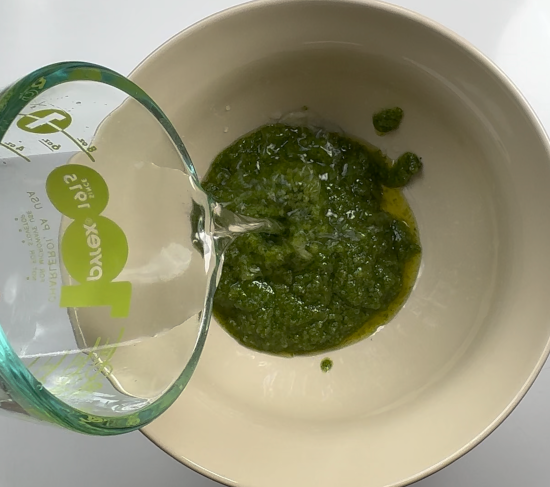 Making pesto sauce by adding water