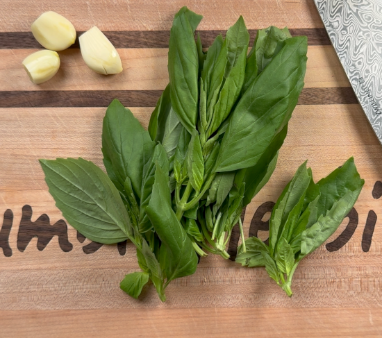 Peeled garlic and basil