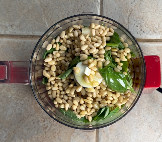 Pesto ingredients in food processor