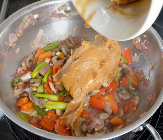 Peanut sauce added to skillet