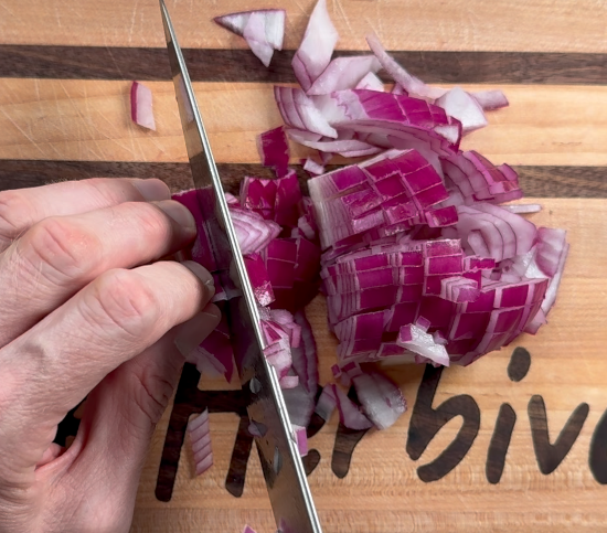 Chopping red onion