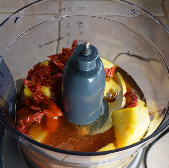 Adding ingredients to food processor to make the sweet and sour sauce