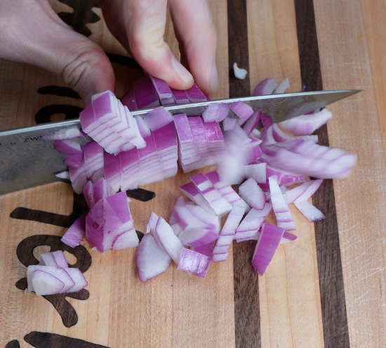 Chopping red onion