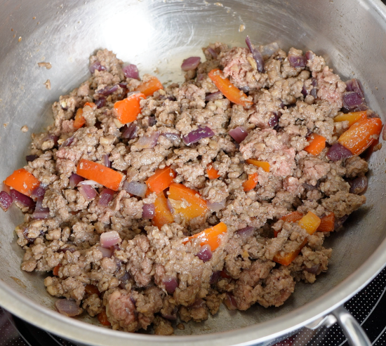 Cooking the Impossible burger, onion, garlic, and bell pepper