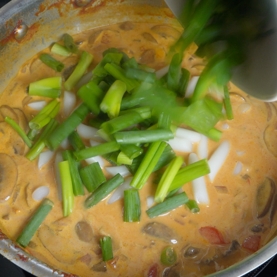 Green onion greens added to the skillet