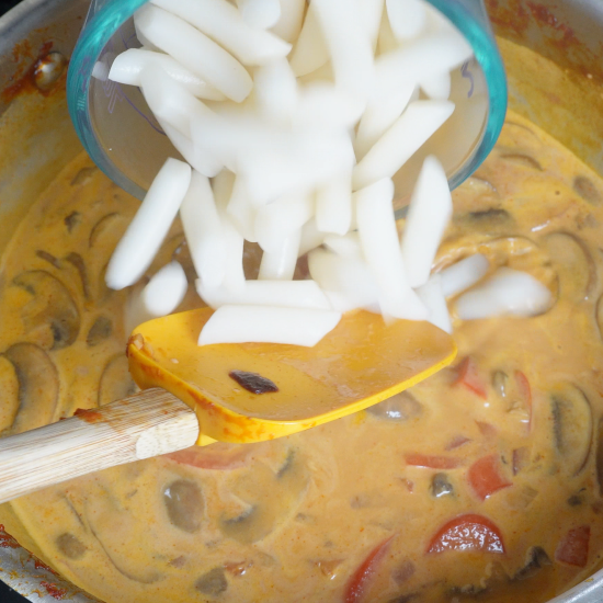 Adding the rice cakes to the skillet