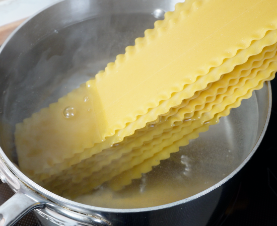 Lasagna noodles being cooked