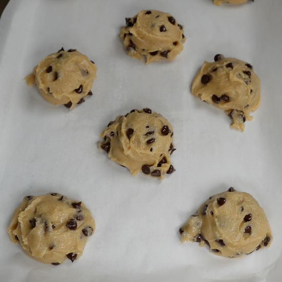 Cookie dough on a baking sheet ready to go in the oven. 