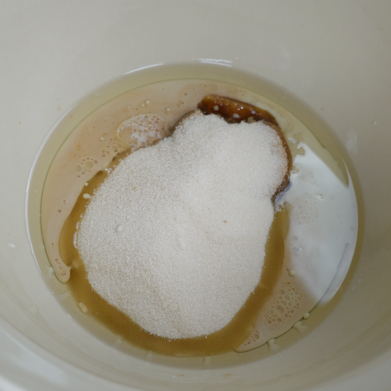 Wet ingredients and the sugars added to the mixing bowl