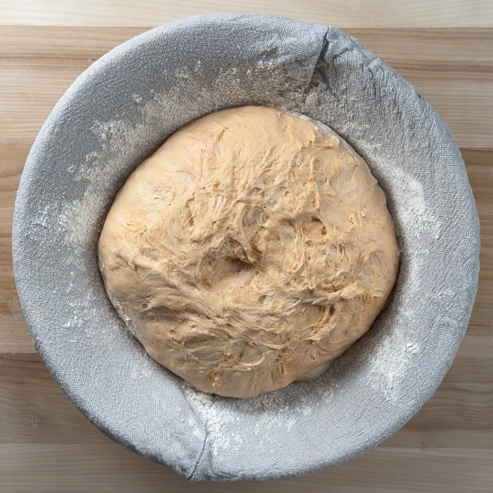 Dough in bread basket ready to proof in the refrigerator overnight