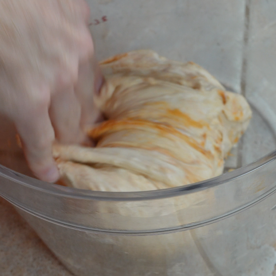 Performing a stretch and fold on the dough