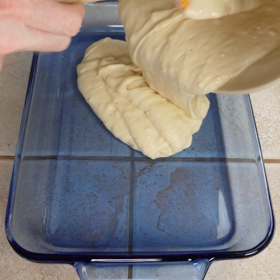 Filling the baking dish with cake batter