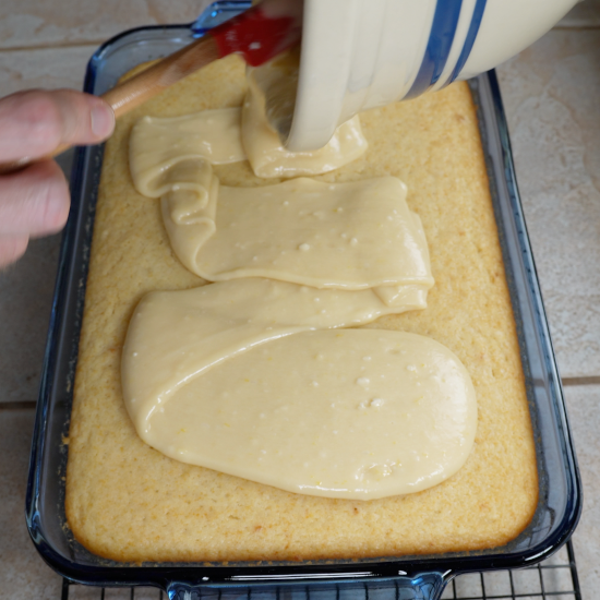 Adding the frosting to the cake