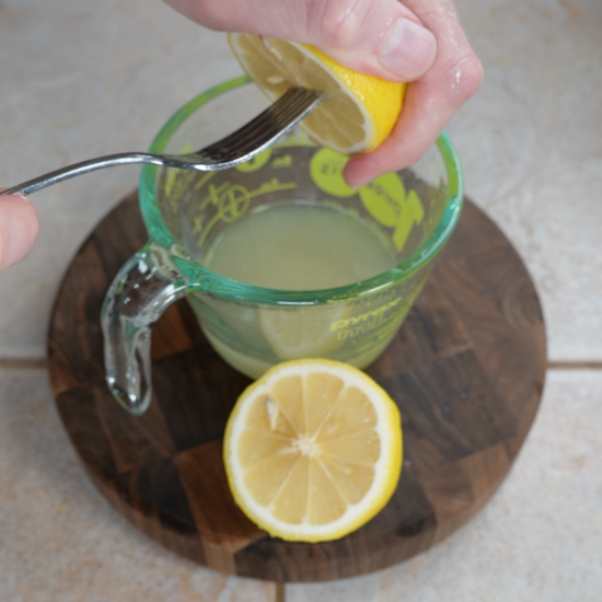 Juicing the lemons used in this recipe