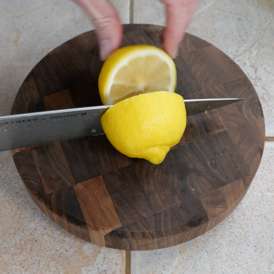 Slicing the lemons in half so they can be juiced