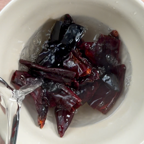 Soaking the chiles in warm water