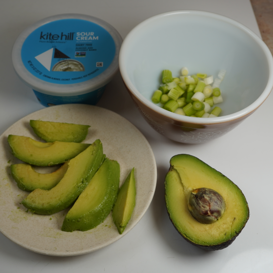 Toppings: vegan sour cream, green onions, and avocado