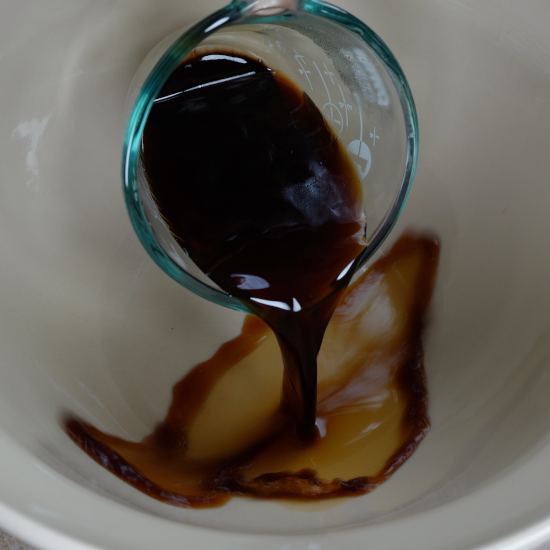 Adding the coffee to the mixing bowl