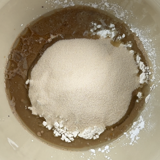 Wet and dry ingredients added to the mixing bowl