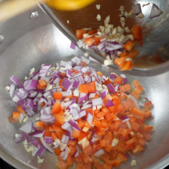 Cooking garlic onion, and red bell pepper