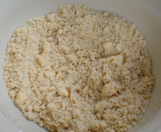 Crumb topping ready to be placed on top of the apple pie