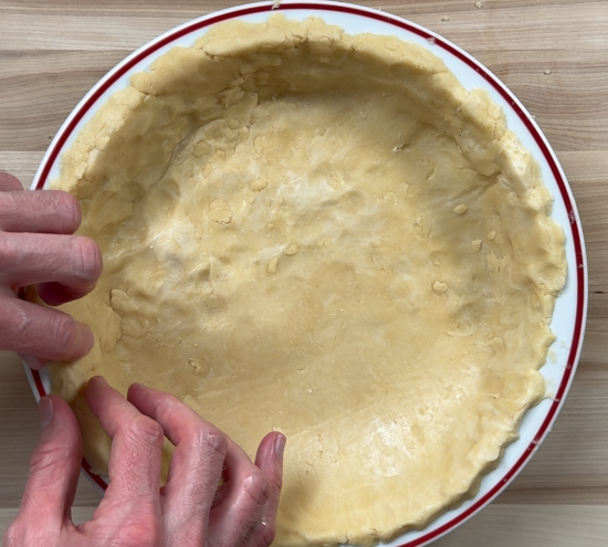 Shaping the crust in the pie plate