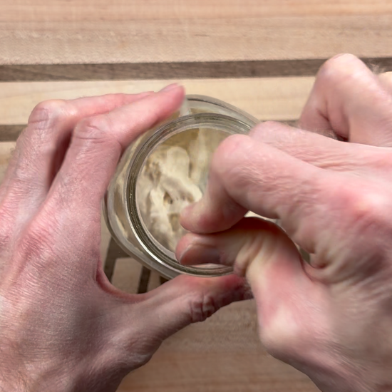 Stirring to combine the starter ingredients