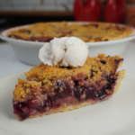 Cherry pie with crumb topping served with vegan vanilla ice cream
