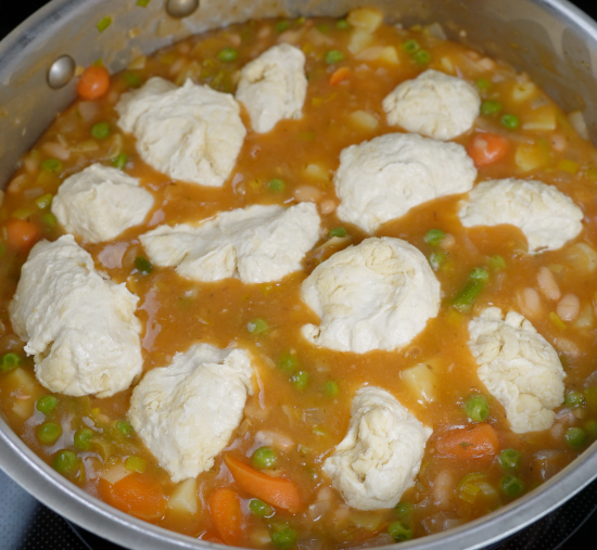 Leek and bean casserole with biscuits ready to bake in the oven