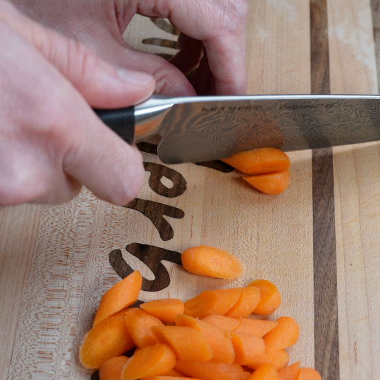 Slicing the carrots into small rounds