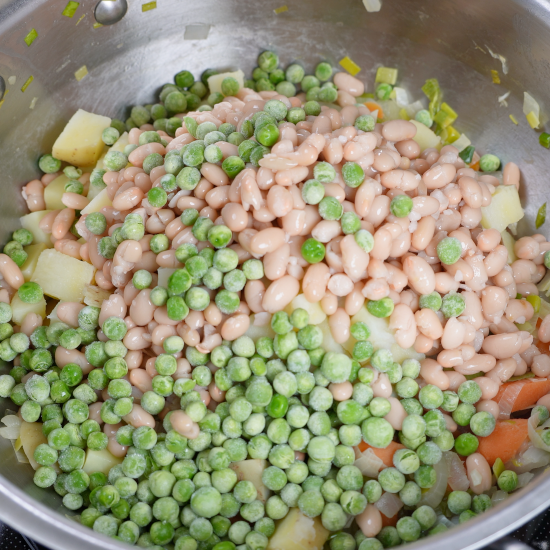 Green peas added to the skillet