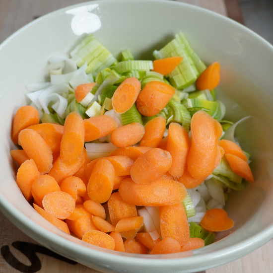 Prepared veggies combined in a mixing bowl
