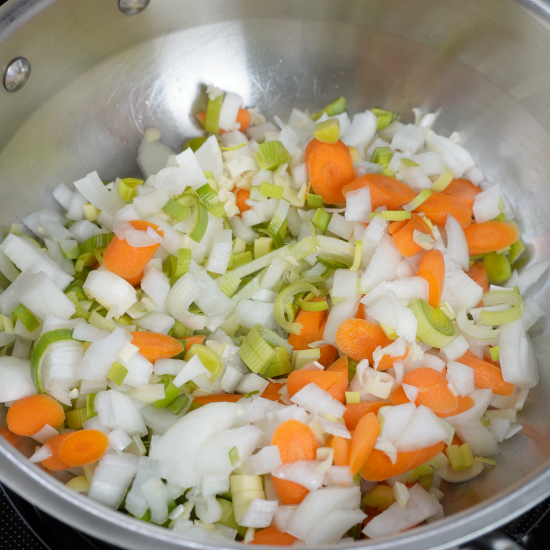 Leeks, onion, garlic, and carrots added to the pan to sauté