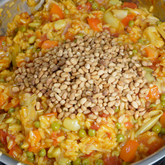 Add the roasted pine nuts