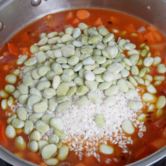 Baby lima beans added to the skillet
