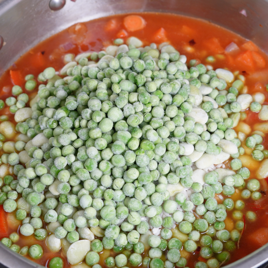Green peas added to the paella