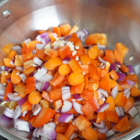 Sautéing the veggies in olive oil in a large skillet