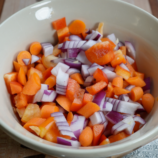 Prepared veggies combined in a small mixing bowl