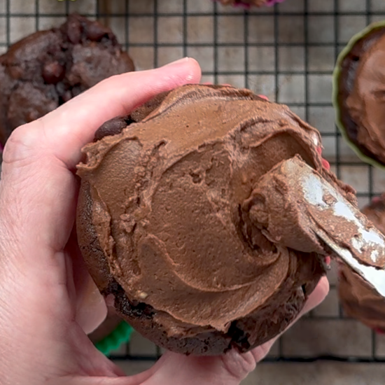 Adding the frosting to the cupcakes