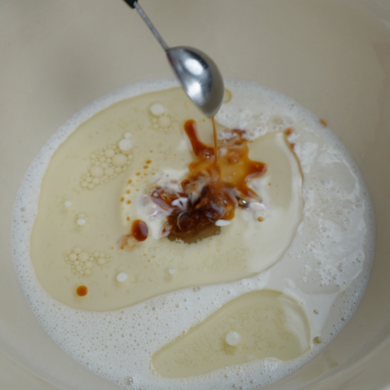 Vanilla extract added to the mixing bowl